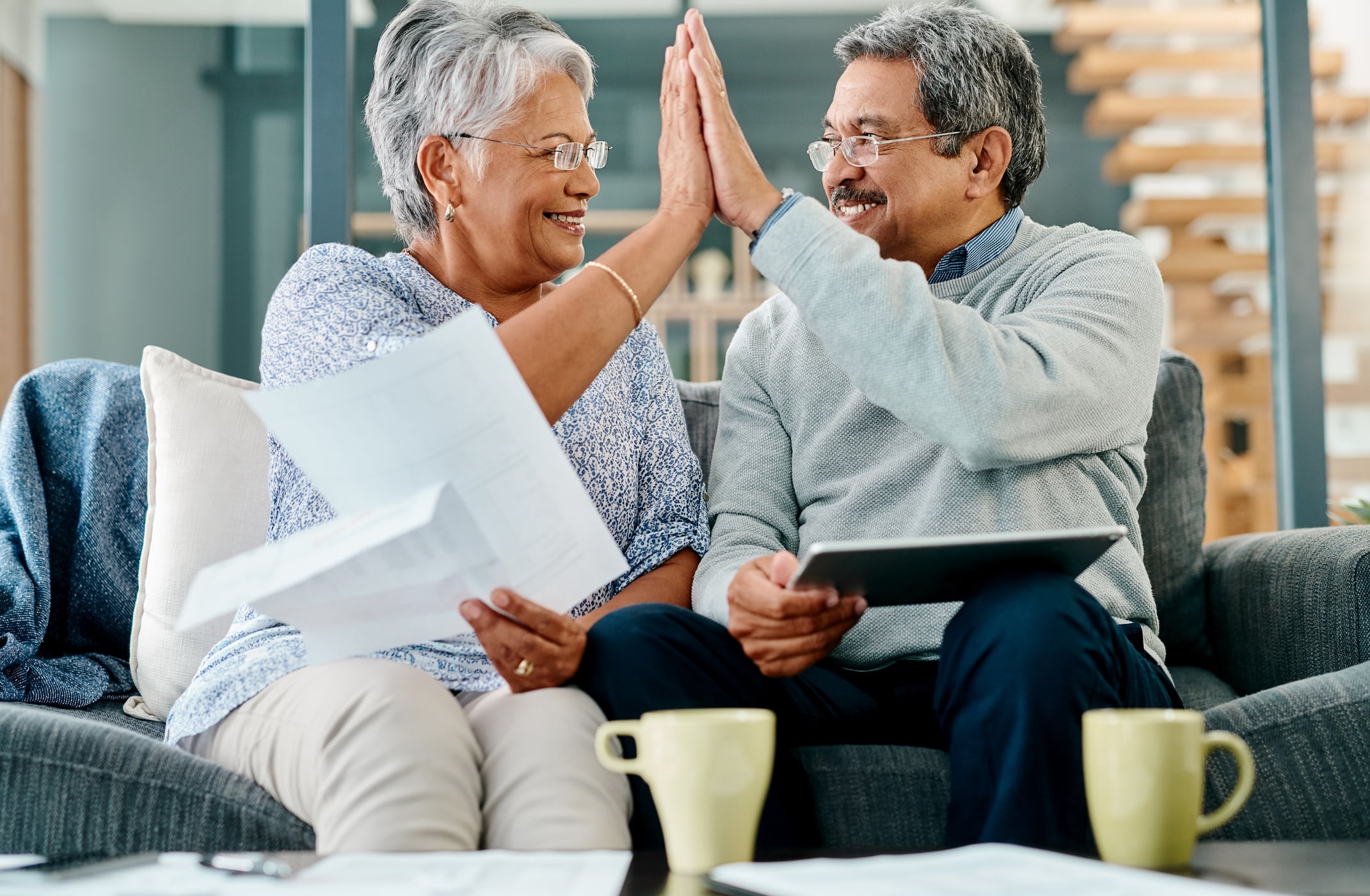 Altavista Gold IRA Investing Company getty couple high five happy